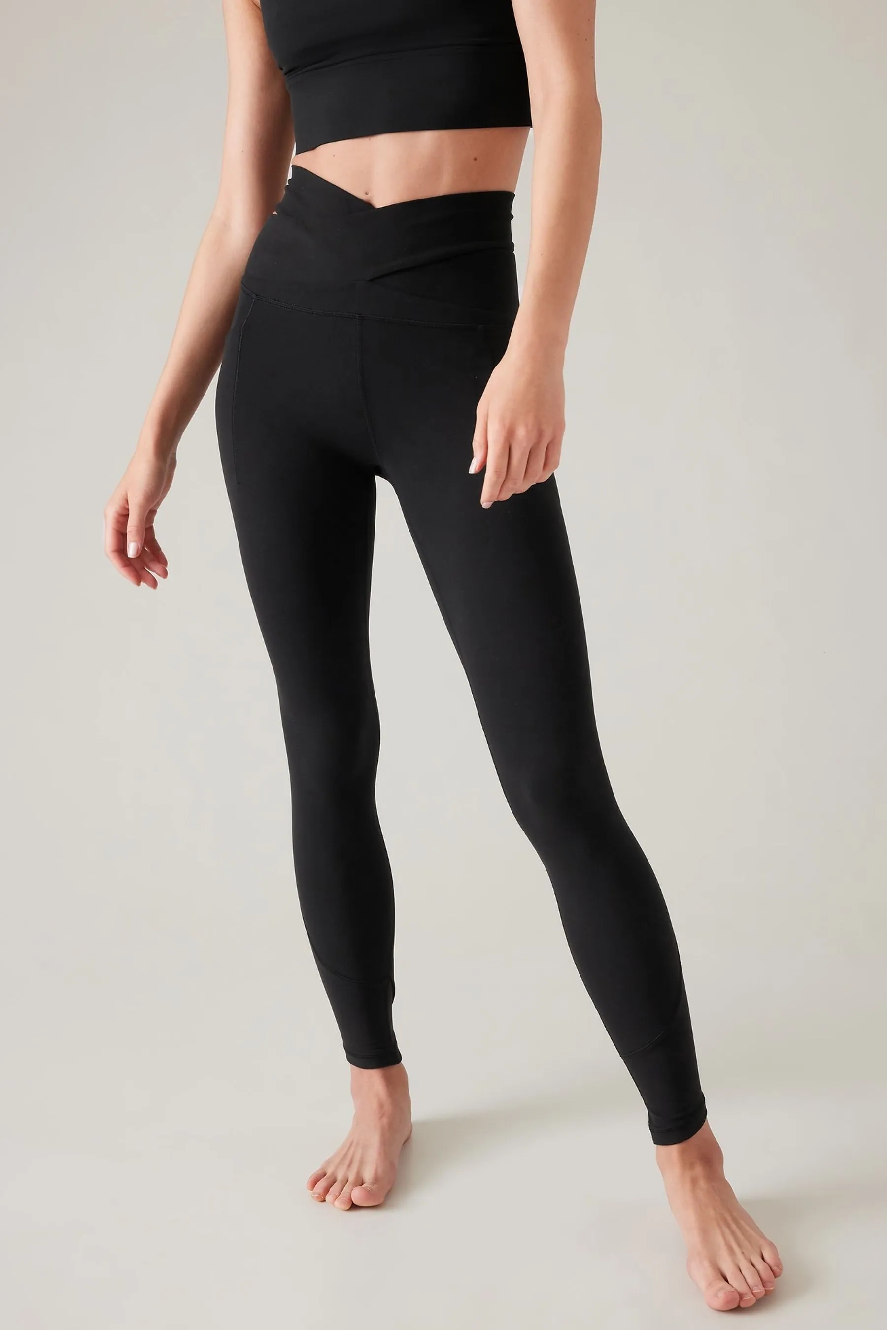 Athleta Black Salutation Stash Wrap Leggings