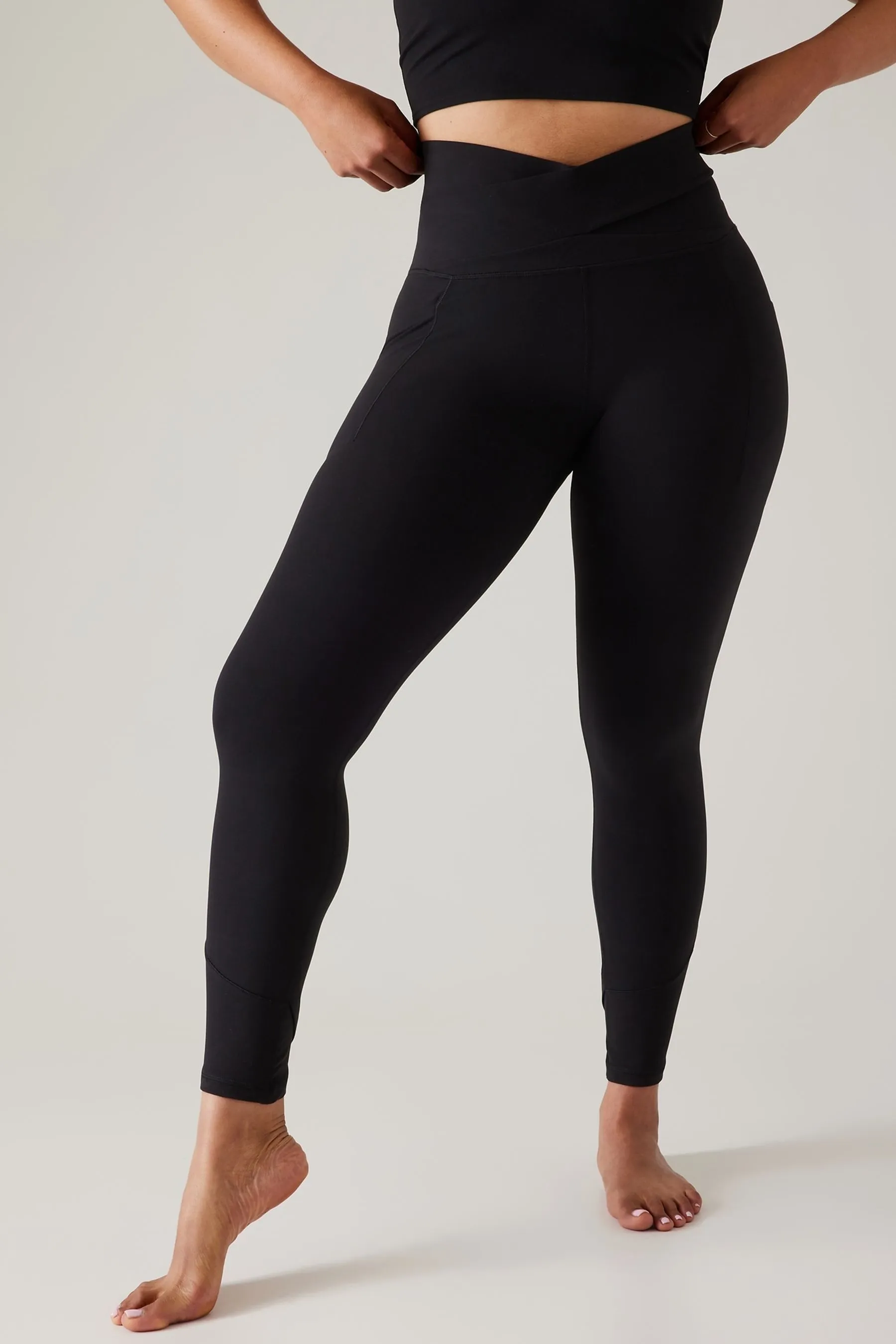 Athleta Black Salutation Stash Wrap Leggings